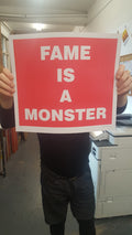 FAME IS A MONSTER (RED)